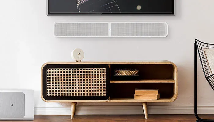 Bluesound PULSE SOUNDBAR+, white lifestyle view at Toma Audio