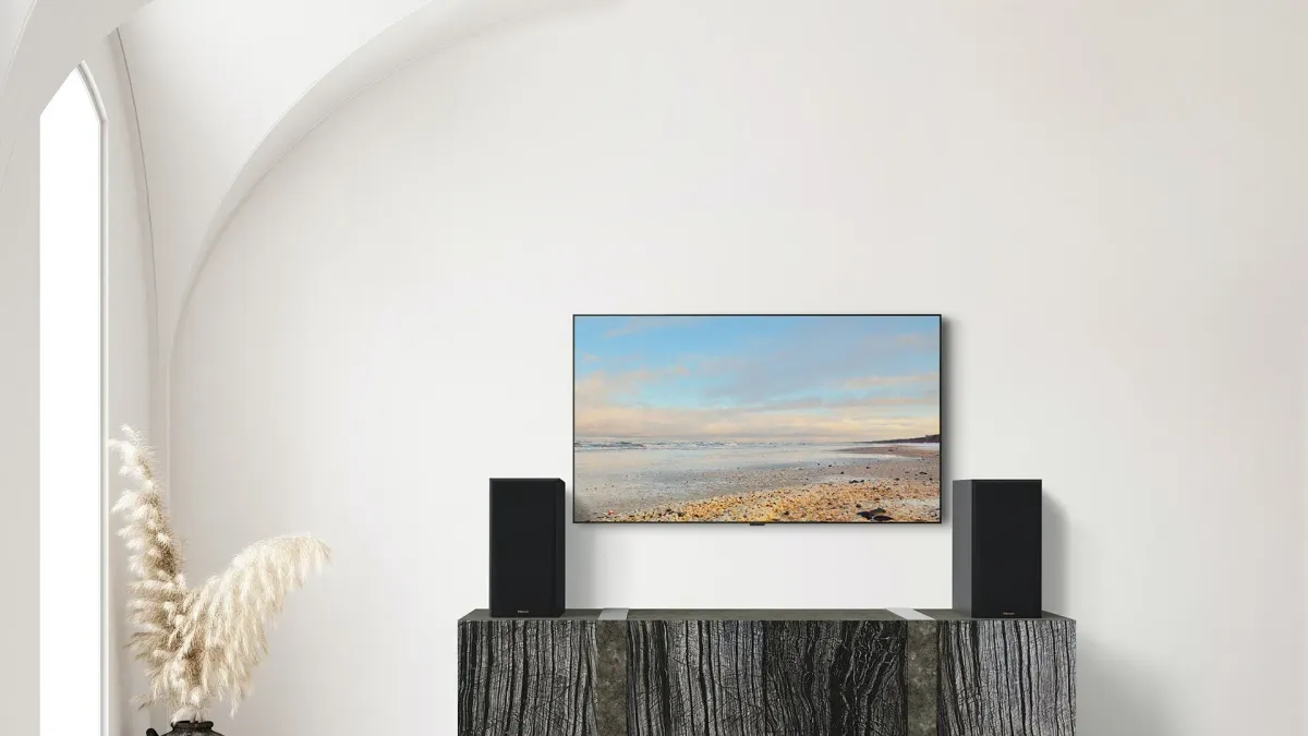 Klipsch RP-600M II - [2-way Horn 6.5"], RP 600M II On A Dark Grey Wooden Credenza Under A TV at Toma Audio